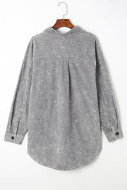 Textured corduroy overshirt in cloudy blue with faded wash and button details.