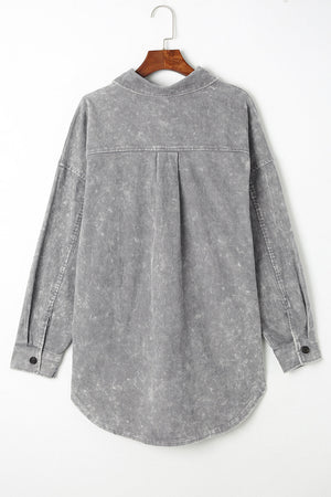 Textured corduroy overshirt in cloudy blue with faded wash and button details.