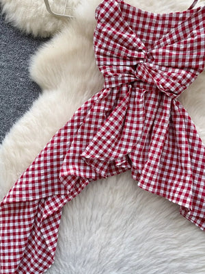 Red gingham cami top with twisted knot detail and asymmetrical hem