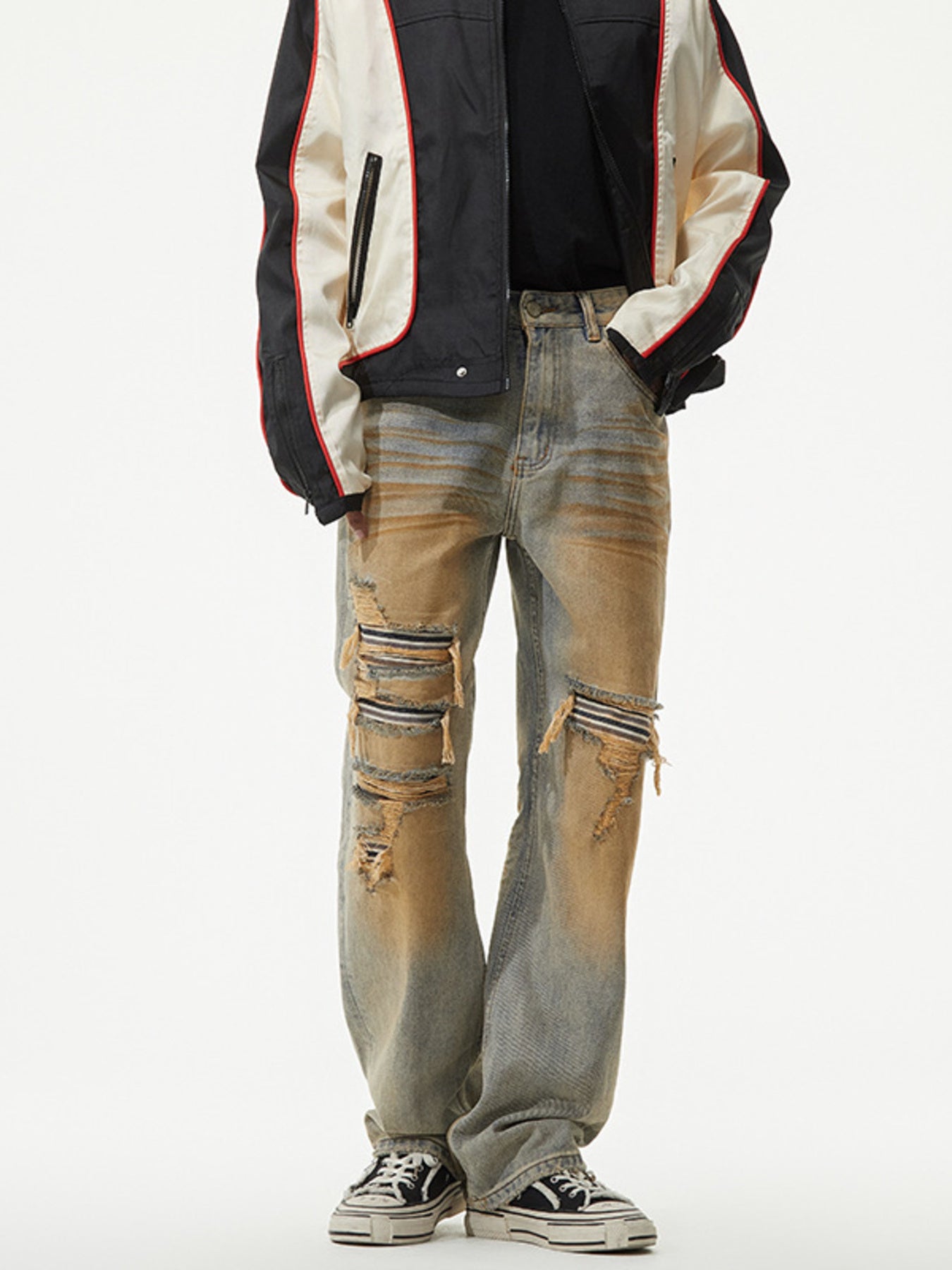 Men's distressed jeans with unique wash and ripped details.
