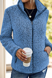 Teddy fleece zip-up jacket in Royal Blue with zip pockets and a stand-up collar.