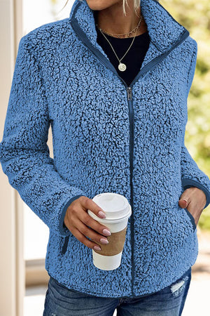 Teddy fleece zip-up jacket in Royal Blue with zip pockets and a stand-up collar.
