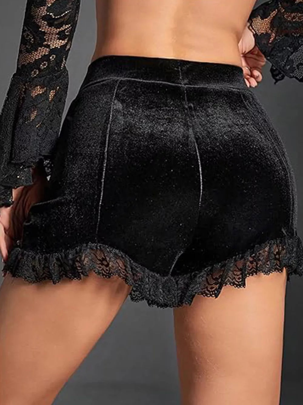 Black velvet high-waisted shorts with ruched lace trim and a comfortable fit.