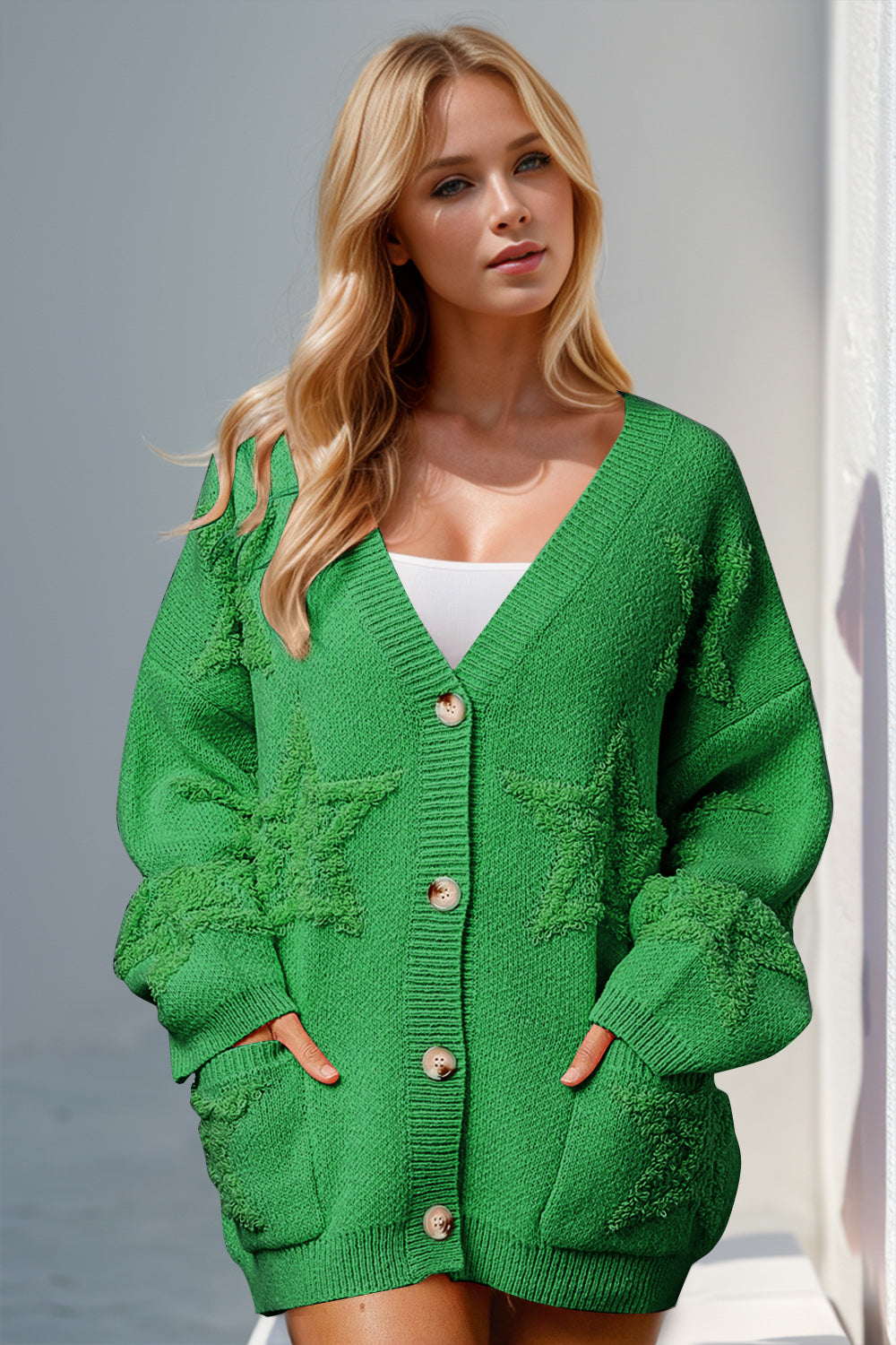 Green textured starburst pocket cardigan with button front and V-neck