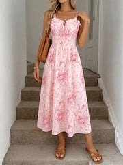 Pink floral cami midi dress with frill neckline and tie detail.