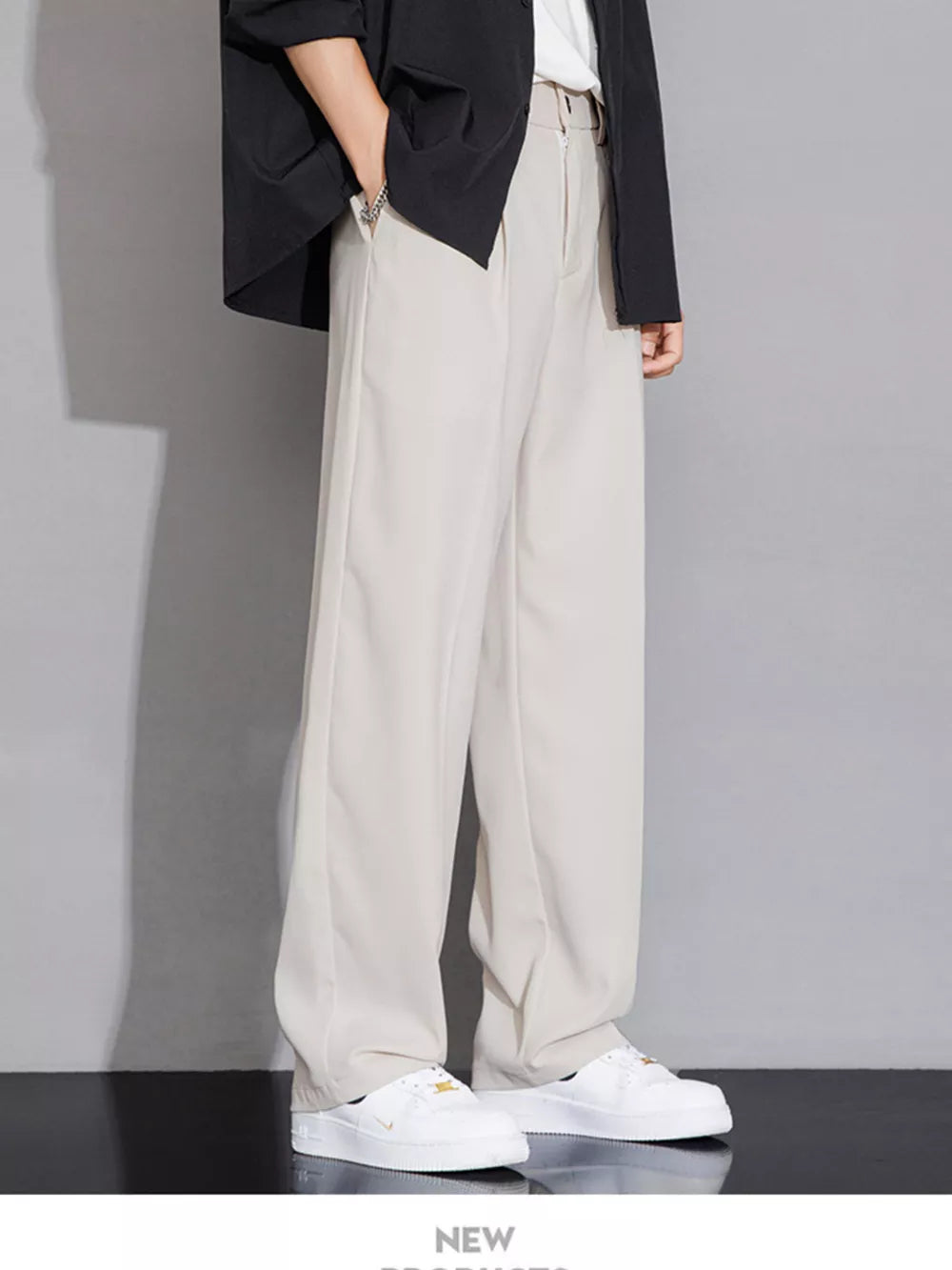 Men's beige wide-leg chinos with a relaxed fit and clean front.