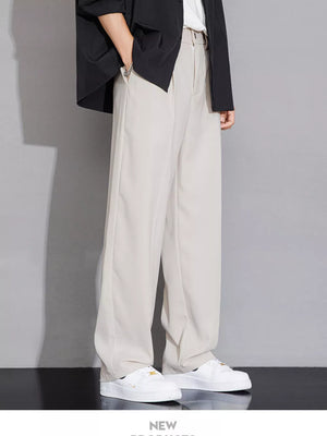 Men's beige wide-leg chinos with a relaxed fit and clean front.