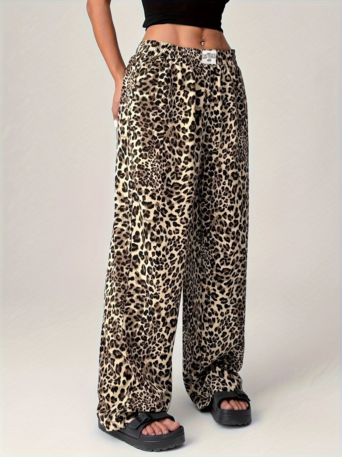 Leopard print palazzo lounge trousers with a wide leg and elastic waistband.