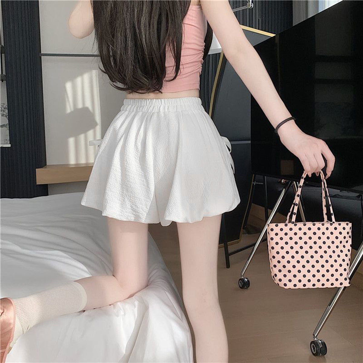 White bowknot bubble skirt with high waist and textured fabric.