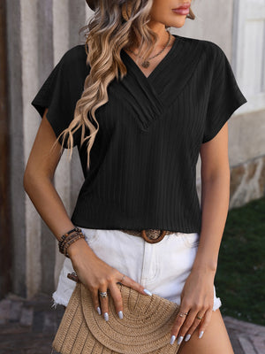 Black textured surplice v-neck tee with short sleeves and a subtle ribbed pattern.