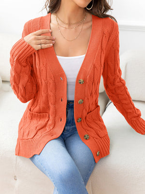 Orange cable-knit cardigan with pockets and buttons, acrylic material.