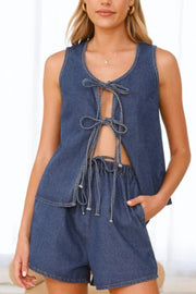 Denim tie-front lounge set in medium blue, featuring a sleeveless top with cutout and drawstring shorts.