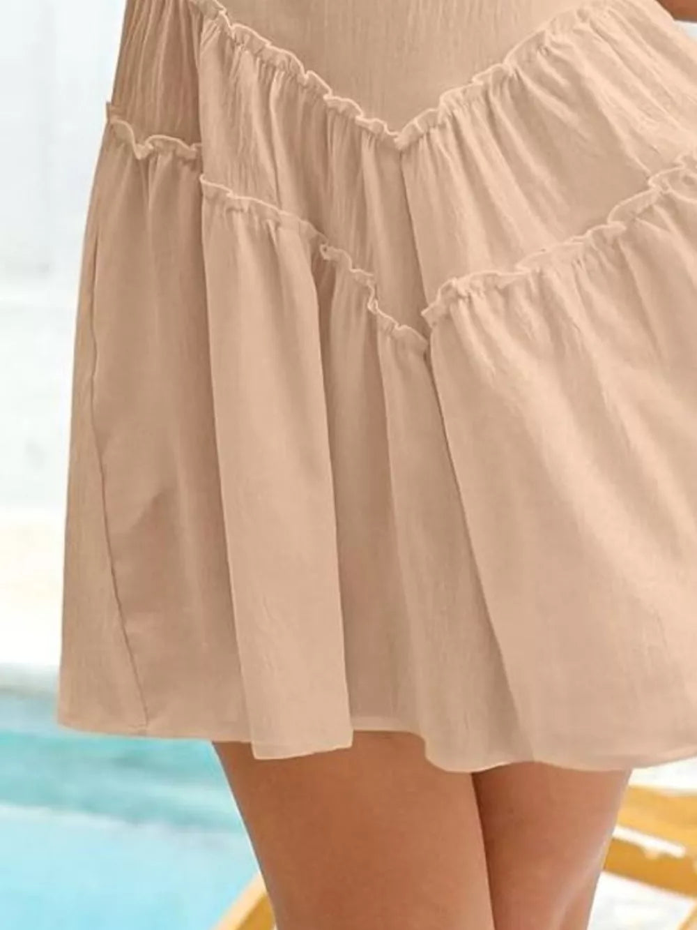 Apricot frill tiered mini dress with ruffled details and a hidden pocket.