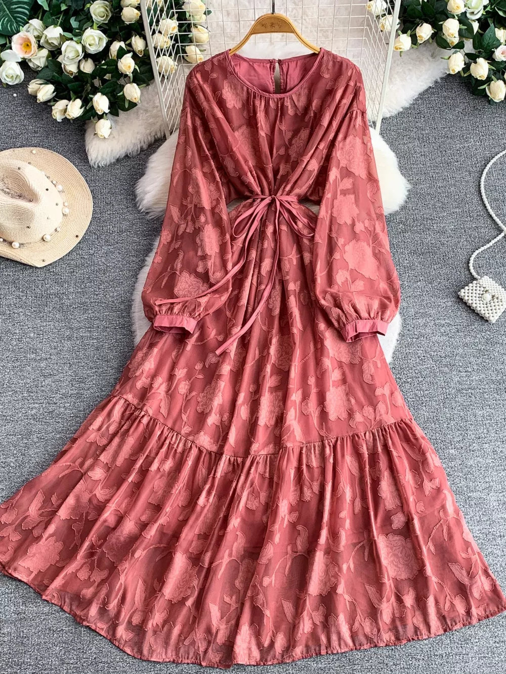 Rust embroidered tie-waist dress with long sleeves and tiered skirt