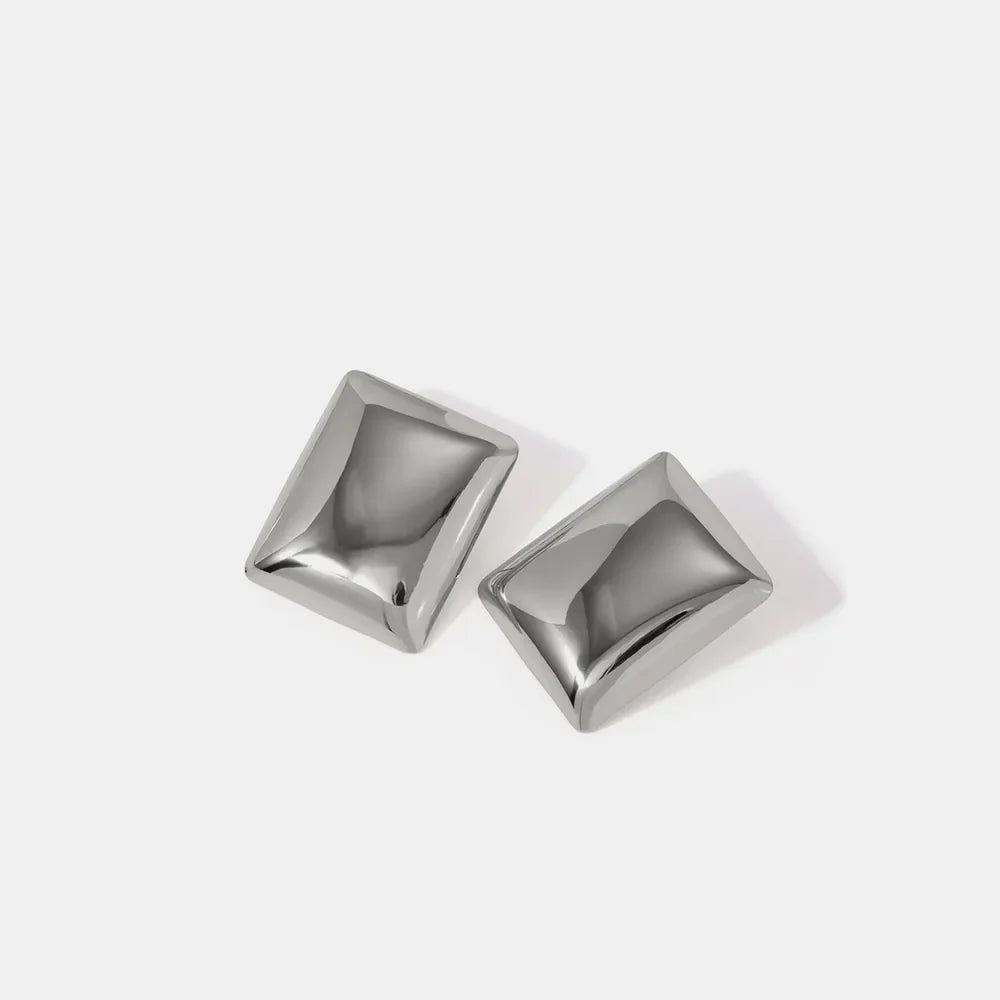 Sculpted silver rectangle earrings with a polished finish.