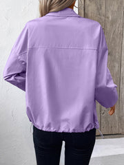 Lavender nylon bomber jacket with drawstring hem and button cuff sleeves.