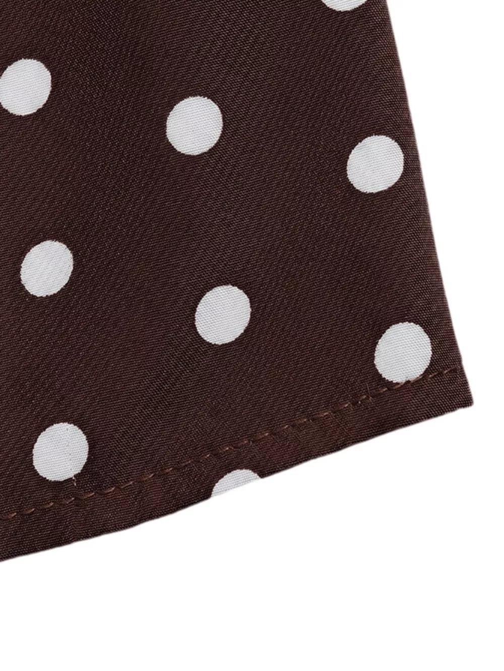 Chic polka dot mini dress in coffee brown with white dots.