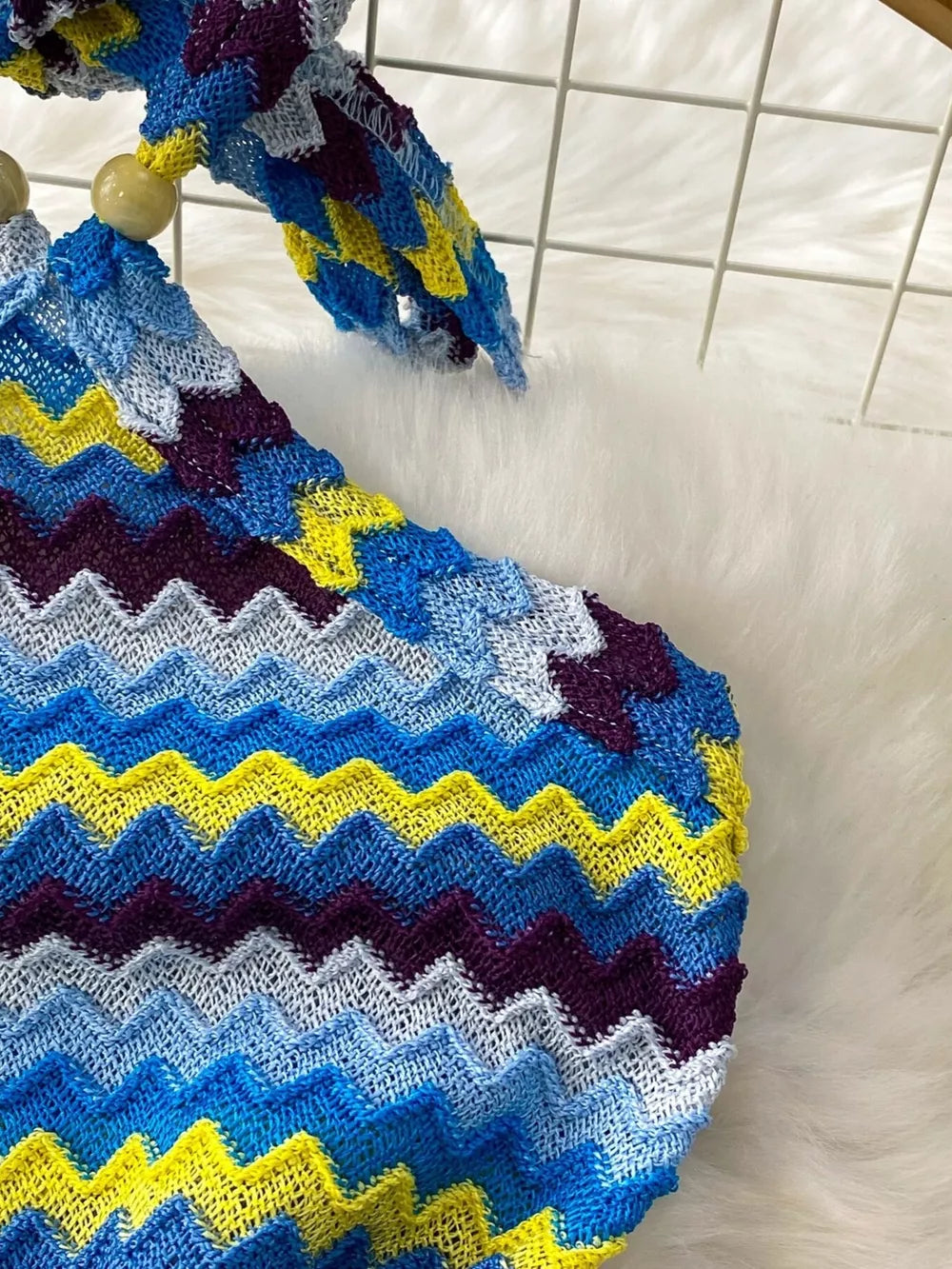 Chevron knit halter crop top with blue, yellow, and purple zig-zag pattern and wooden beads.
