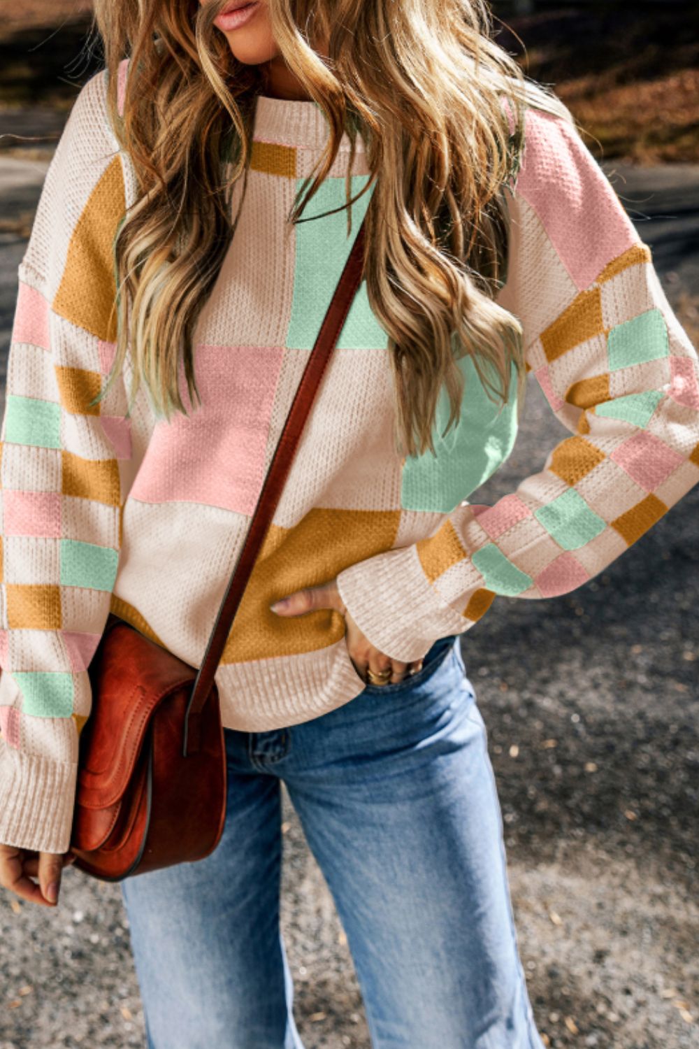 Colorblock checkerboard knit sweater in blush pink, mint green, and mustard yellow acrylic with a crew neck.