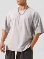 Boxy cut gray washed cotton t-shirt with crew neck and short sleeves.
