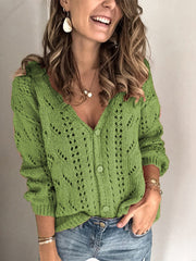 Green chevron knit button-down cardigan with openwork details and matching buttons.