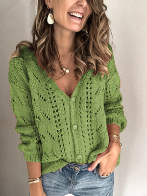 Green chevron knit button-down cardigan with openwork details and matching buttons.