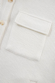 White textured corduroy overshirt with patch pocket and button detail.