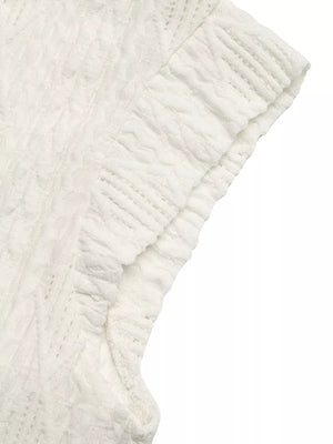 Diamond knit cap sleeve t-shirt in white with textured fabric detail.