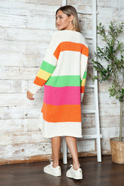Beige midi sweater dress with rainbow stripes, long sleeves, and crew neck.
