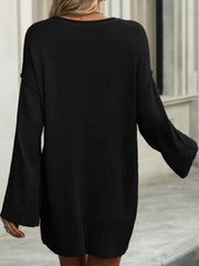 Black oversized ribbed knit tunic sweater with bell sleeves and crew neck.