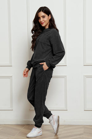Dark Gray corduroy lounge set with crew neck sweatshirt and jogger pants featuring a chest pocket.