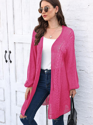 Cable knit cocoon cardigan in Deep Rose acrylic with open front and long sleeves.