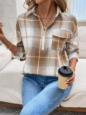 Plaid zip-through utility blouse in camel with a chest pocket and collared neckline.