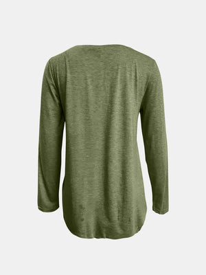 Matcha green long sleeve tee with asymmetrical hem and button detail