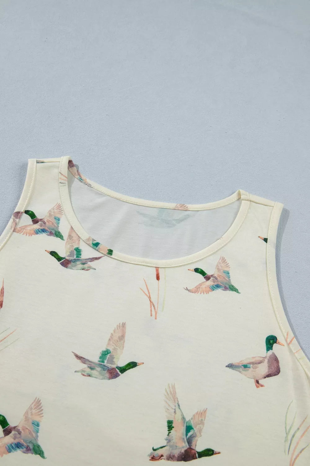 Cream tank top with mallard duck print and cattail accents.