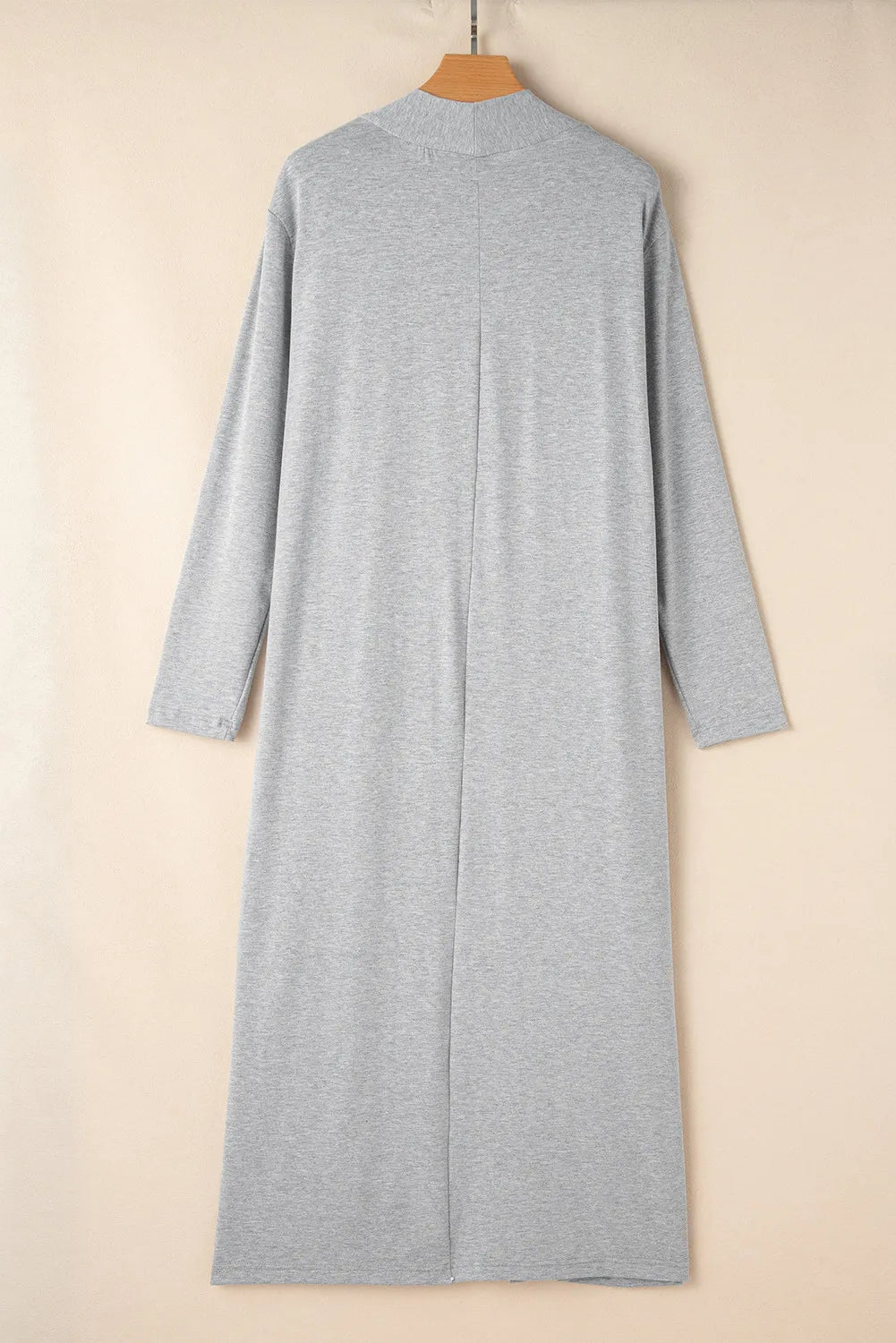Gray duster with mock neck and long sleeves, open front, midi length.
