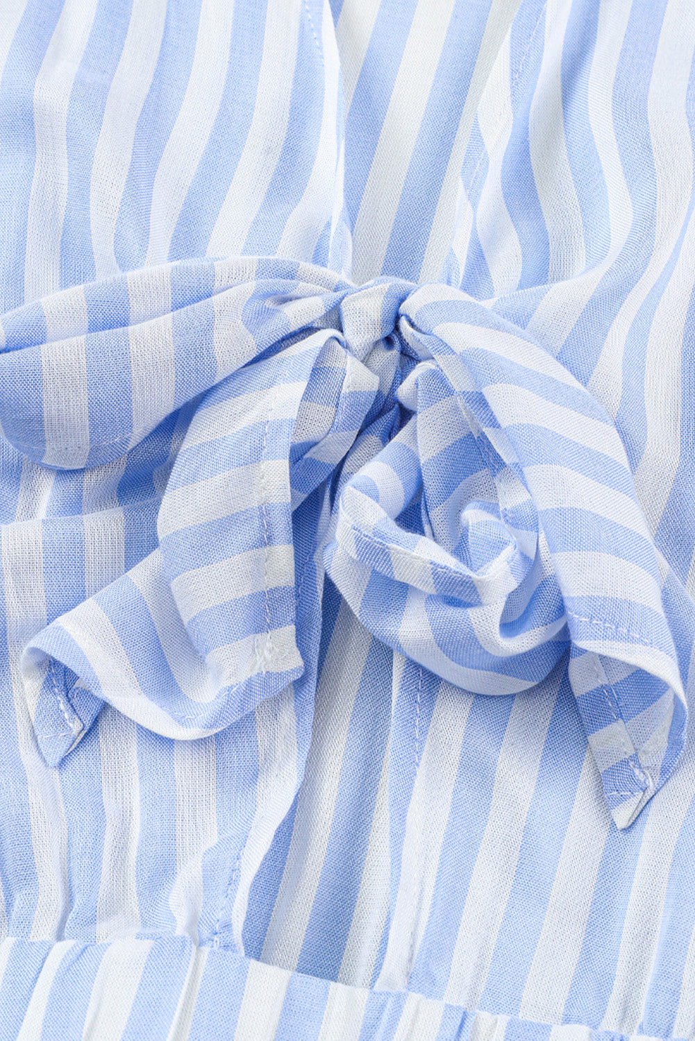 Light blue and white striped jumpsuit with a tie-front detail