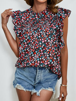 Smocked yoke ruffle sleeve floral blouse with high neck and short sleeves.