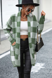 Oversized checkerboard knit duster coat in matcha green with open front and pockets.