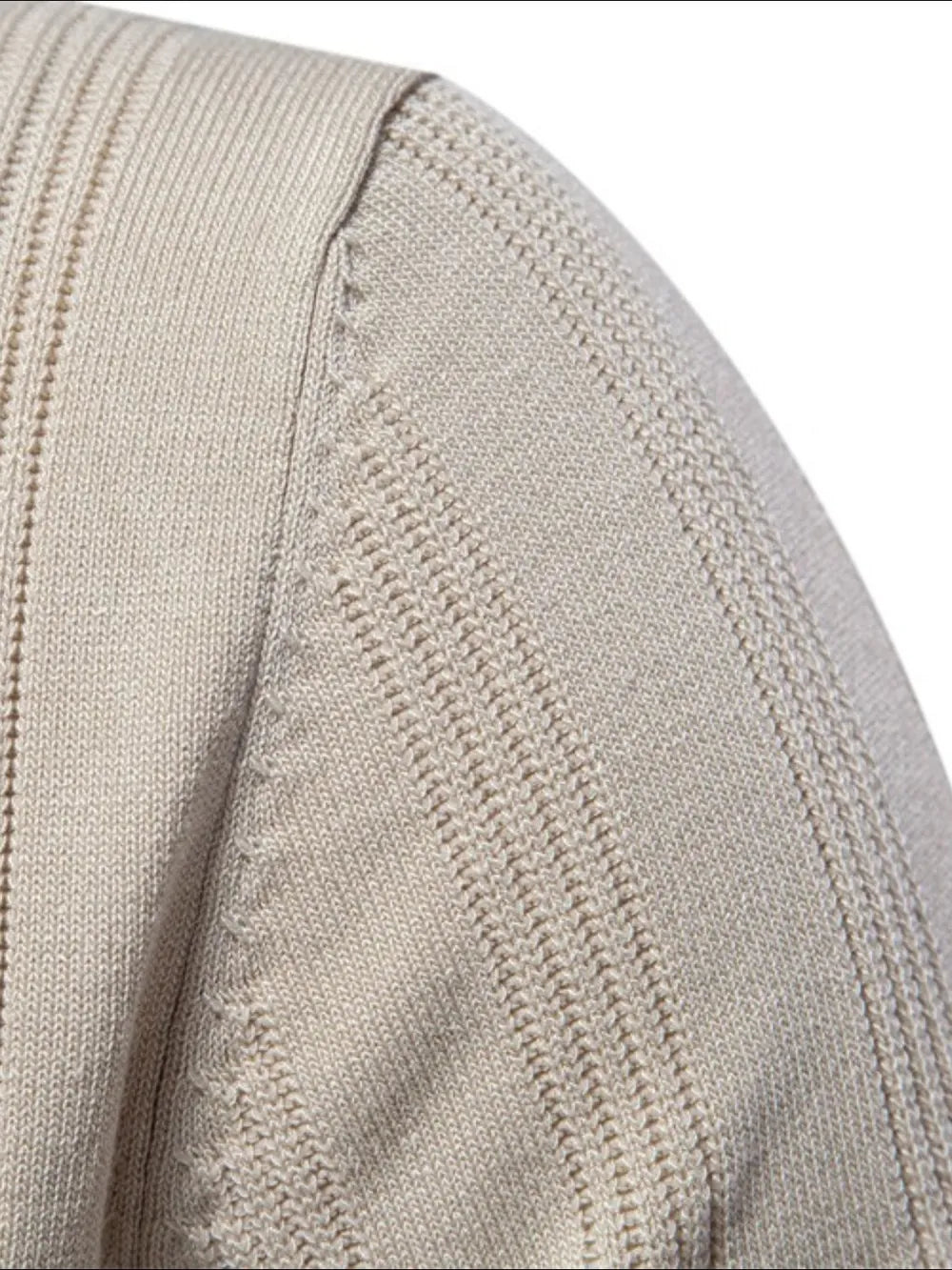 Beige ribbed knit polo shirt with vertical textured details on the shoulder and sleeve.