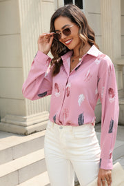 Pink feather print button-down shirt with long sleeves and a classic collar.