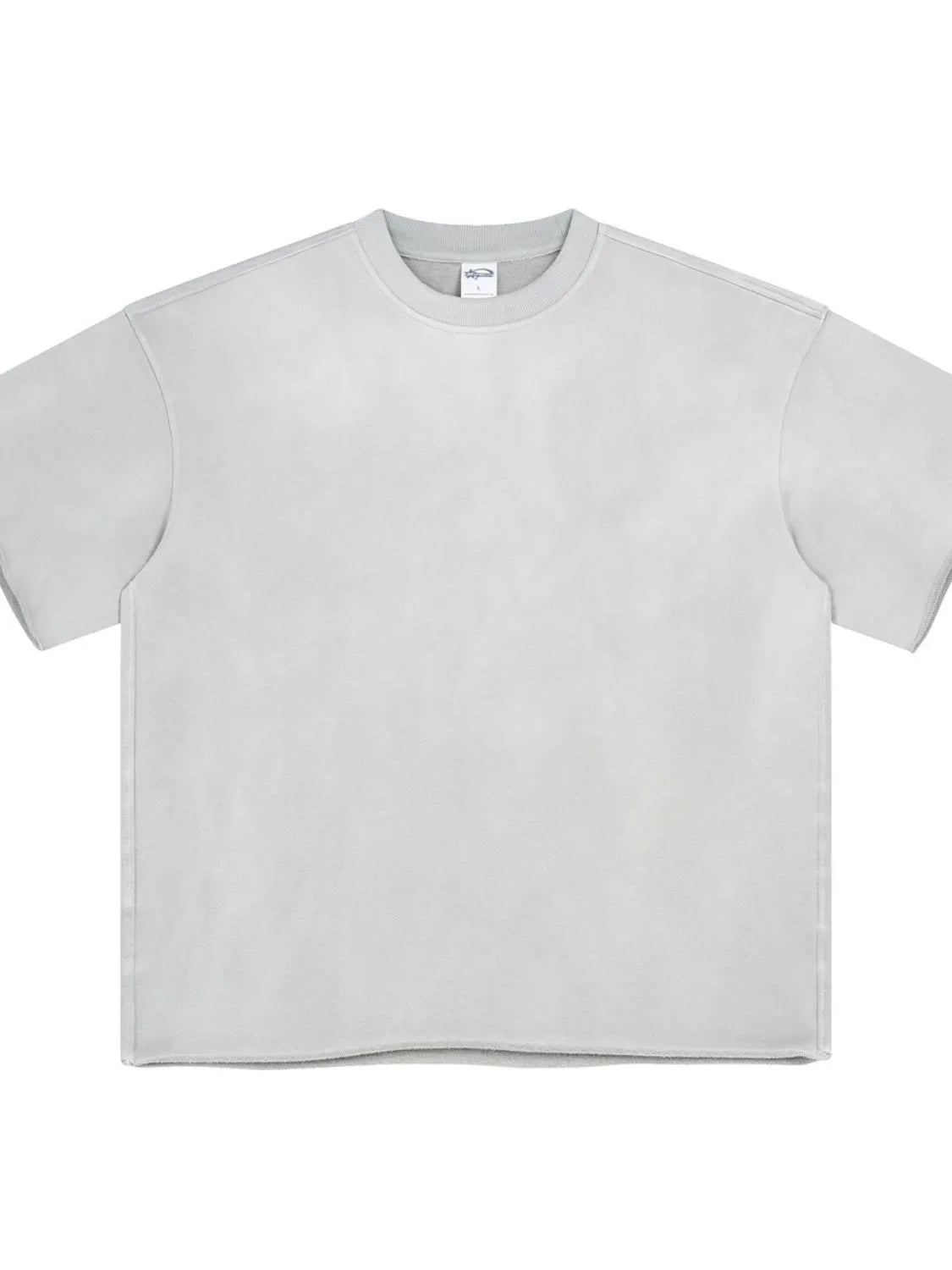 Raw edge boxy t-shirt in light gray with crew neck and short sleeves.