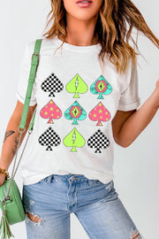 White graphic tee with checkerboard, lightning bolt, and star spade patterns.