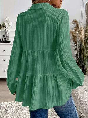Green textured tiered button-down shirt with long sleeves and a collared neckline.