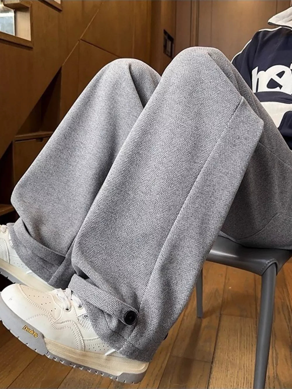 Relaxed fit grey herringbone sweatpants with ankle cuffs and drawstring detail.