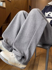 Relaxed fit grey herringbone sweatpants with ankle cuffs and drawstring detail.