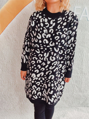 Black and white leopard print knit mini dress with crew neck and long sleeves.