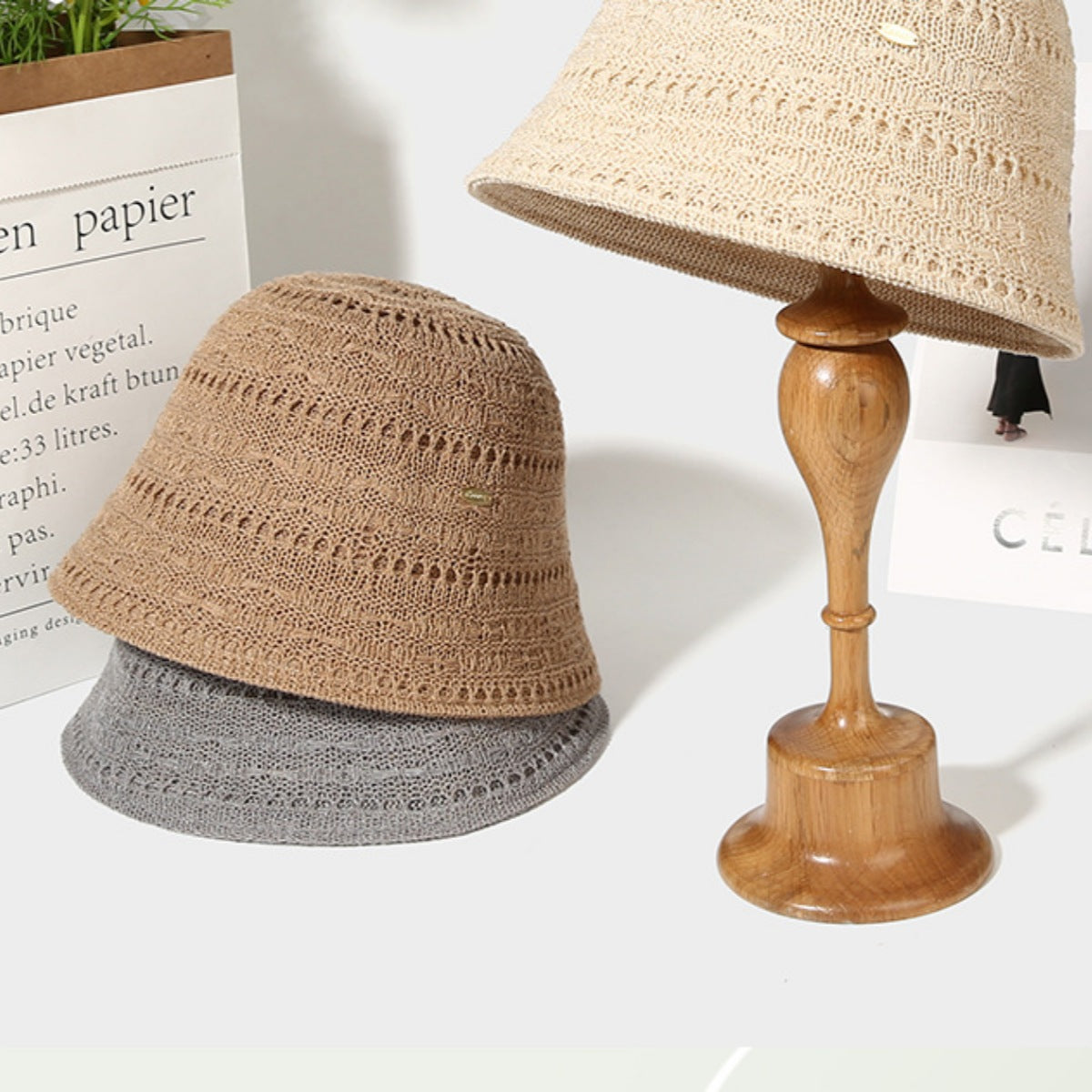 Ventilated knitted bucket hat in beige, khaki, and gray with openwork pattern.