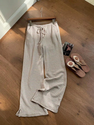 Maternity wide leg trousers in apricot with a subtle stripe pattern and drawstring waist.