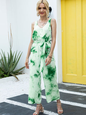 Green tie-dye button-down jumpsuit with tie waist and wide legs.